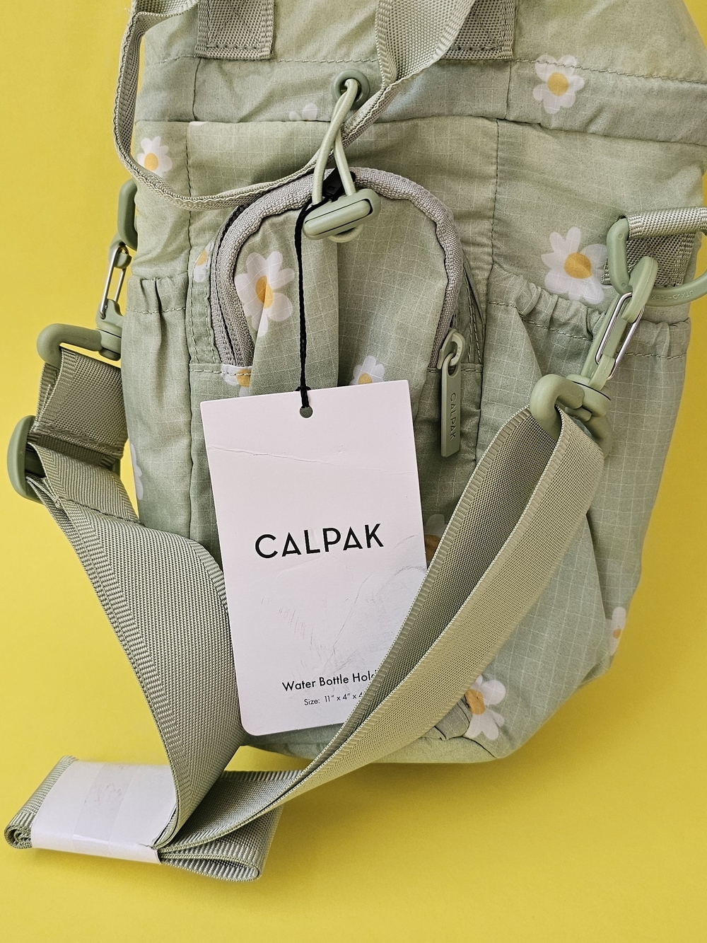 Calpak Sage Green Daisy Crossbody Water Bottle Bag